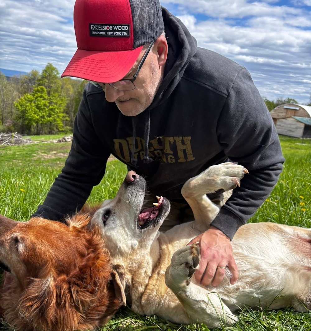 Excelsior Wood Products Owner Ron Sauer with dogs.