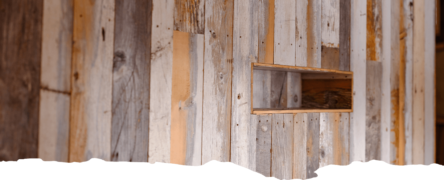 Close up of reclaimed wood siding and paneling